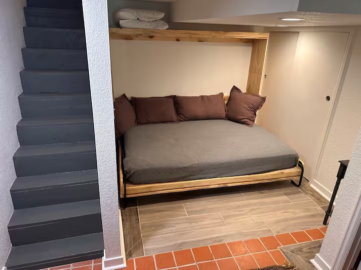 The lower-level bedroom in The Schaeffer, with a queen Murphy bed