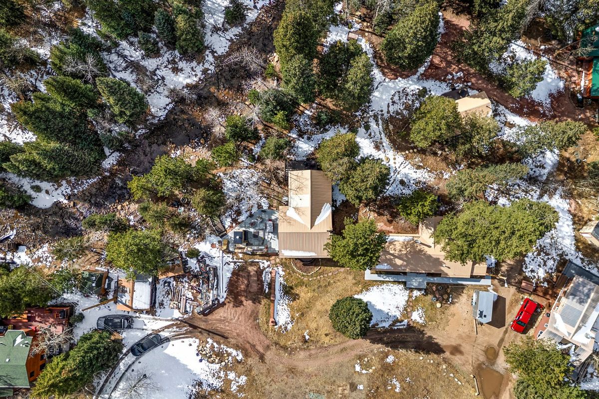 Aerial view of the wooded river property and the St. Vrain canyon
