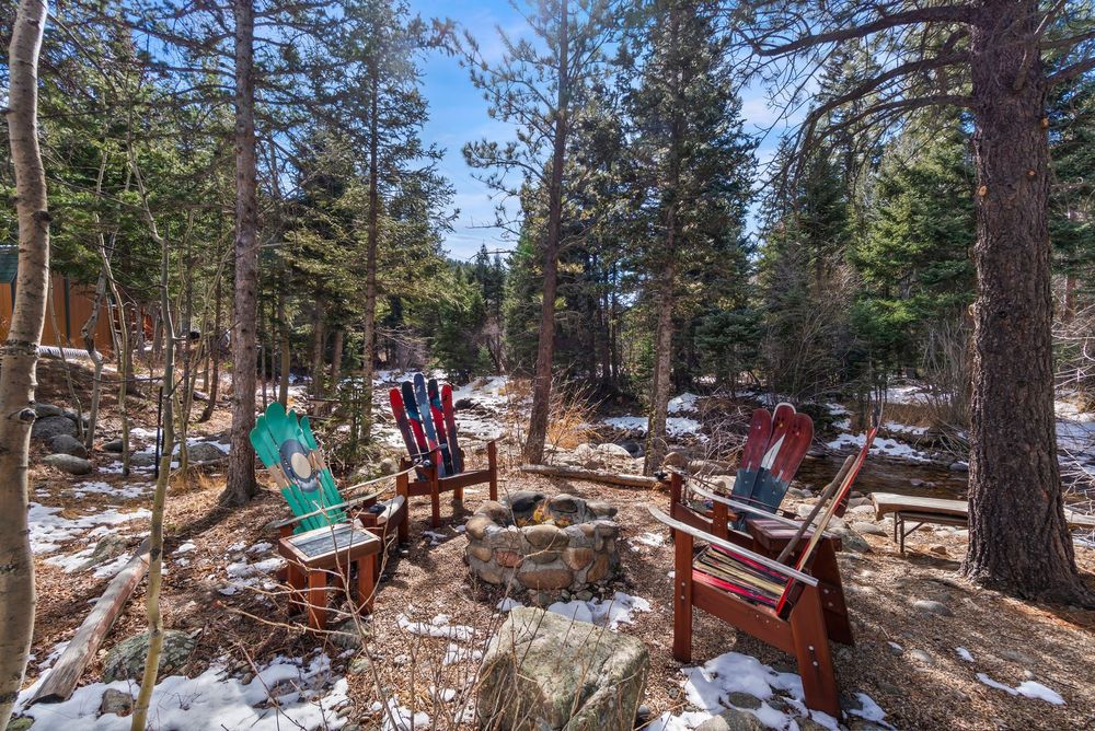 Ski-slat Adirondack chairs around a fire pit
