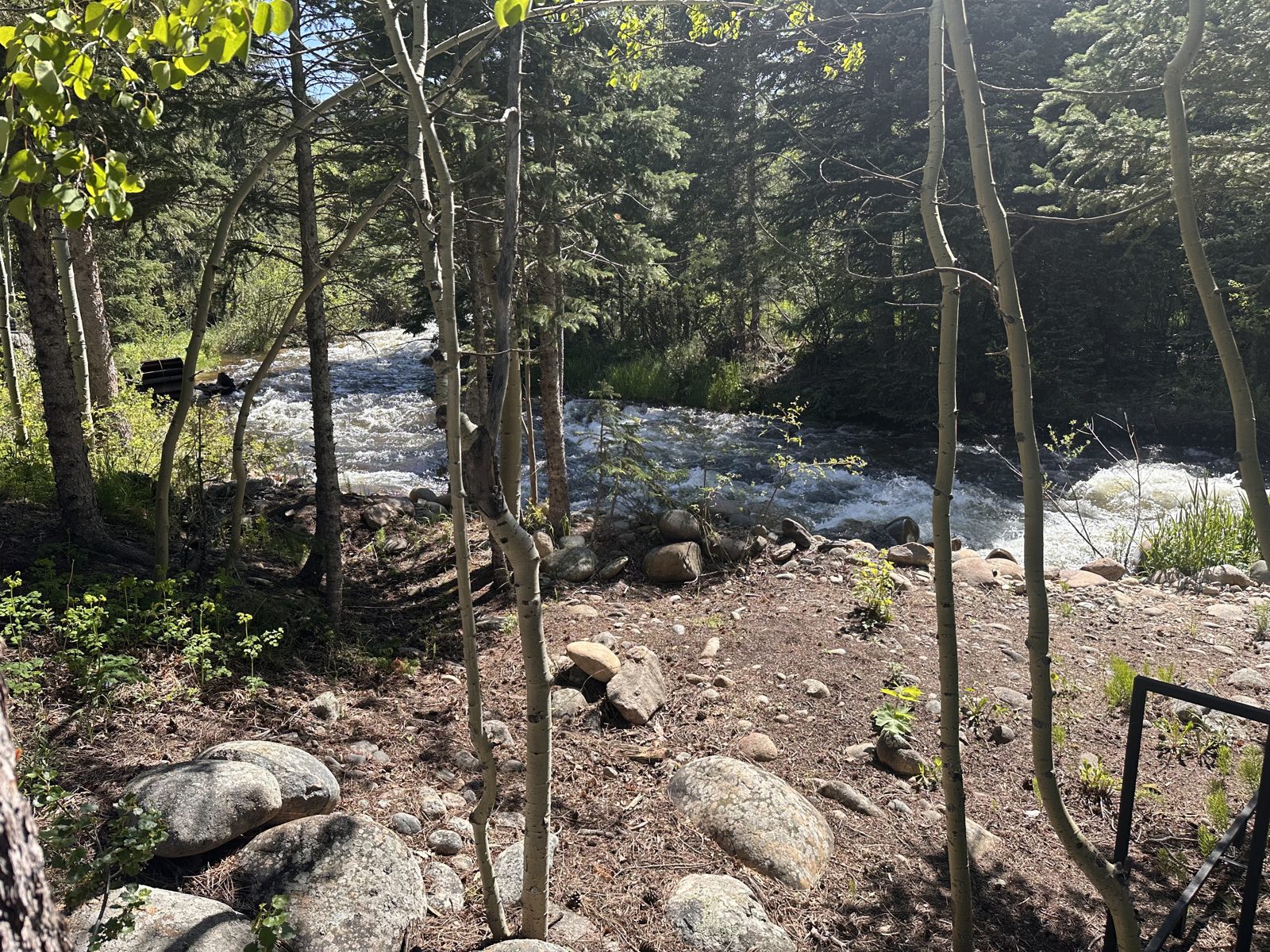 Big granite boulders beside the river at the cold plunge