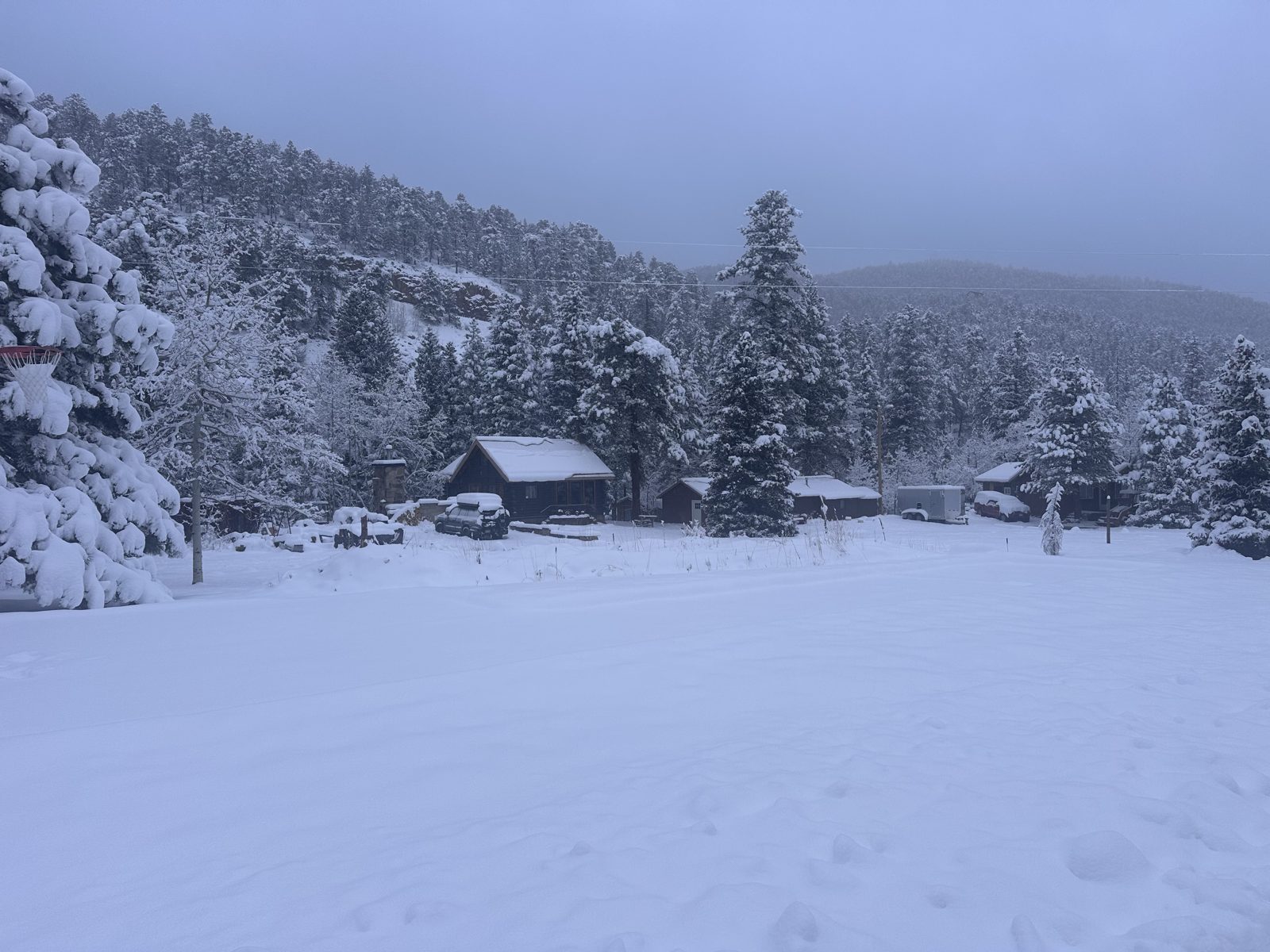 The camp and lawn under fresh snow